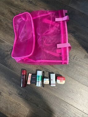Hot Pink Mesh Cosmetic Travel Bag with cosmetic samples